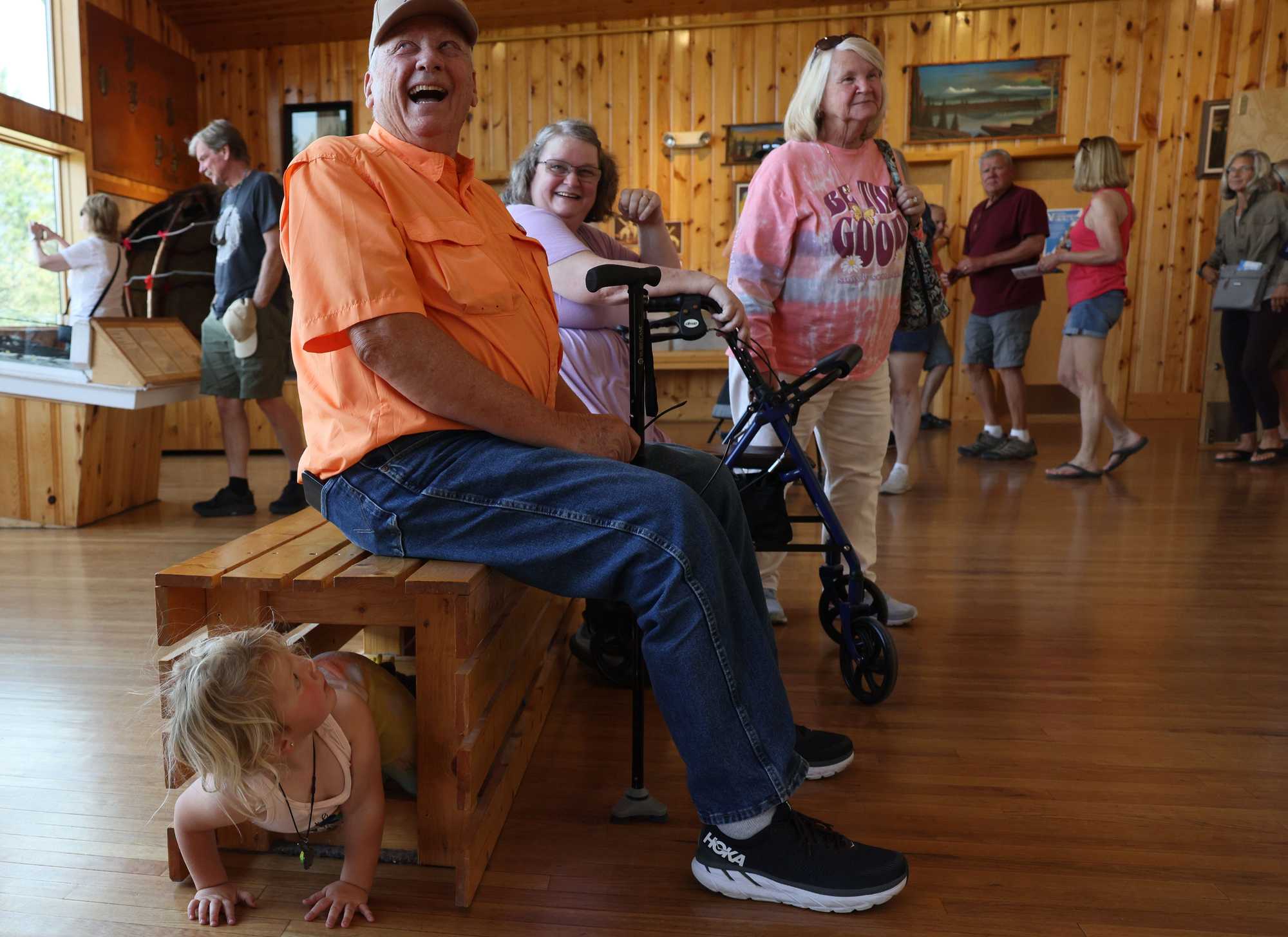 A visitor to the Crazy Horse Memorial laughed after 2-year-old Abigail crawled underneath the bench he was sitting on.  