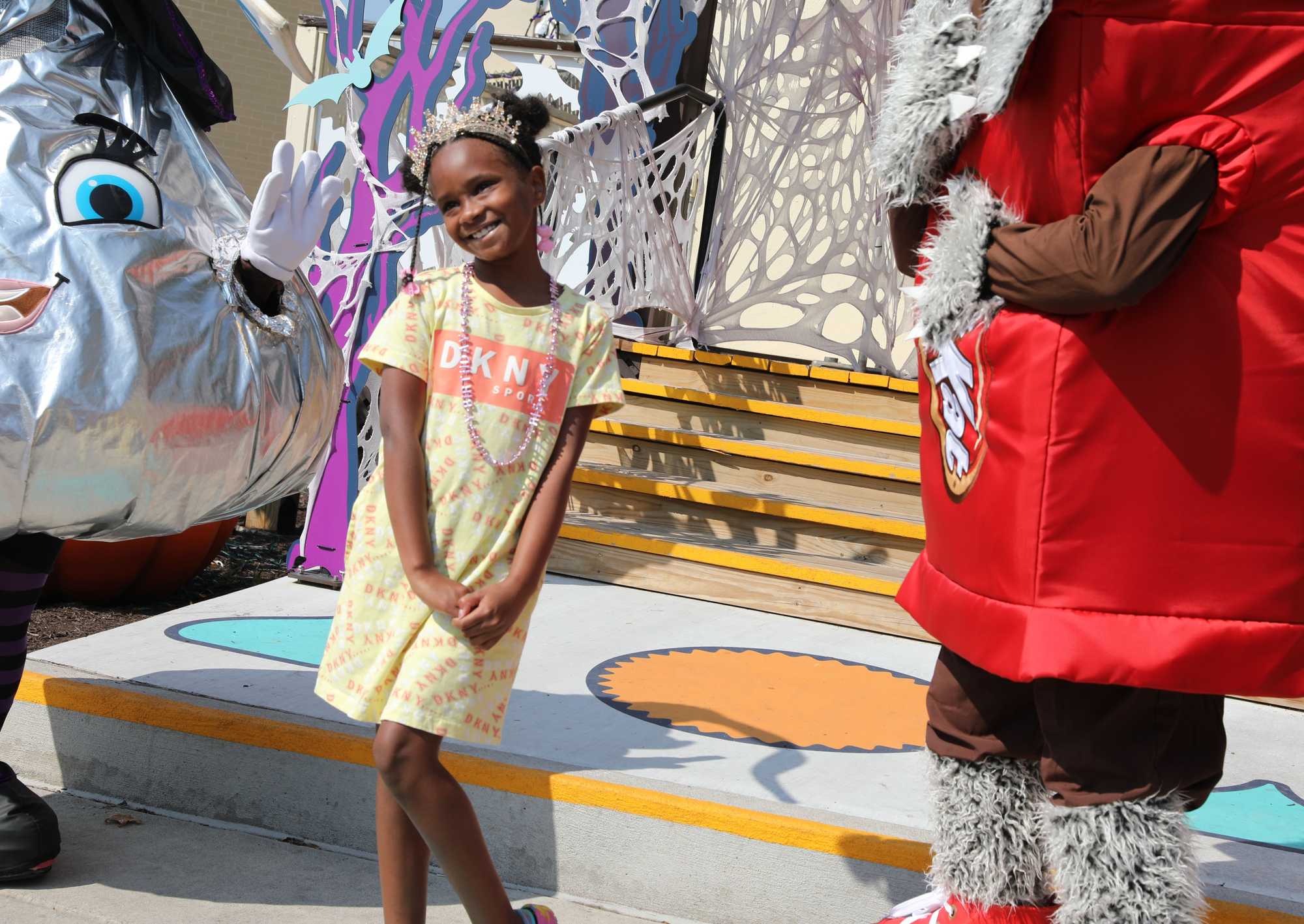 Ja’el Johnson, 7, of Charleston, W.Va., got her picture taken with park characters on her first trip to Hersheypark in Pennsylvania for her birthday. 