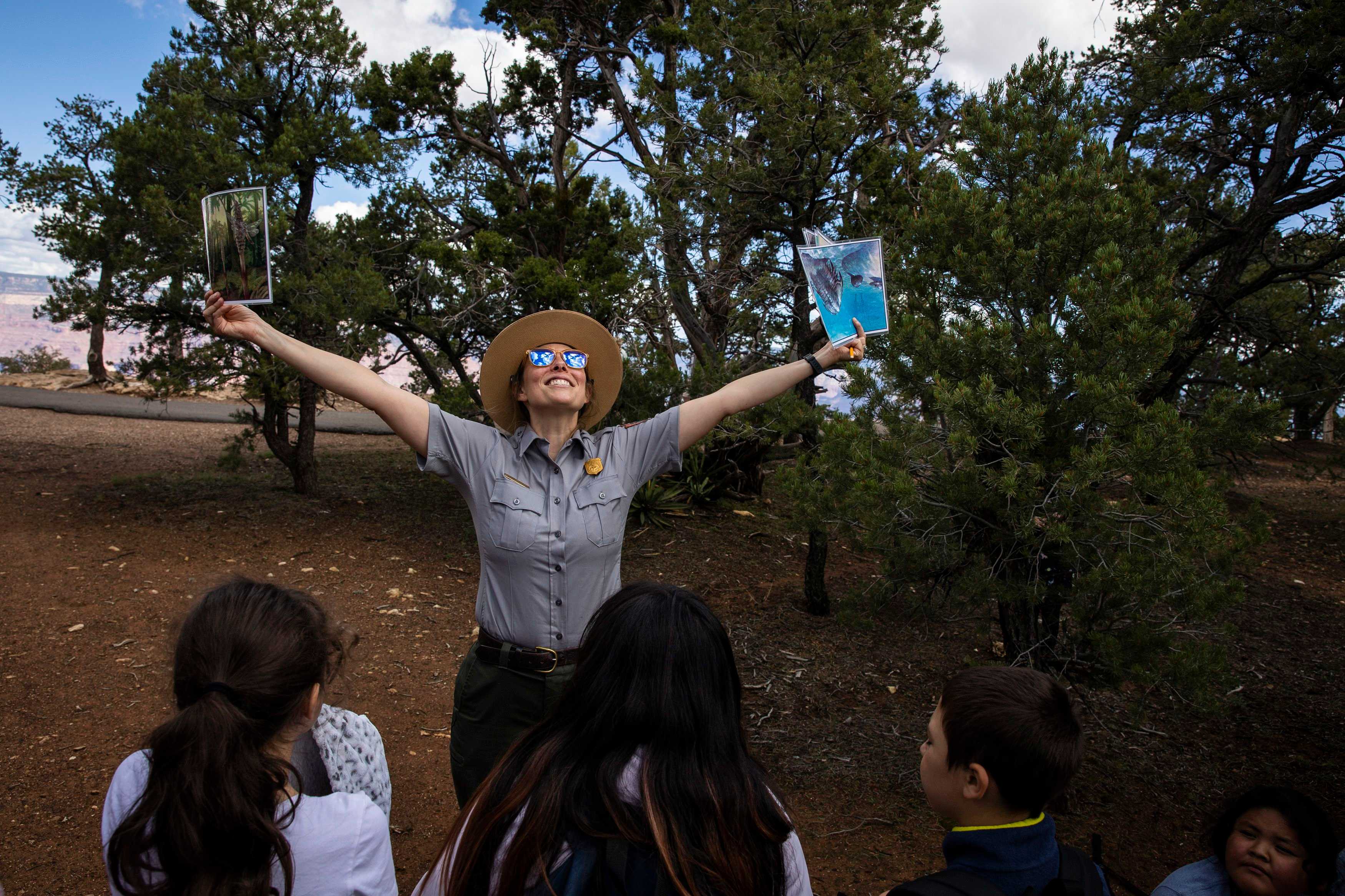 A Grand Canyon National Park ranger guided a fourth-grade class in a lesson on rocks during a class on the rim of the Grand Canyon. The students attend the Grand Canyon School District, which serves just over 250 students across all its grades and is the only school district that is located inside a national park.