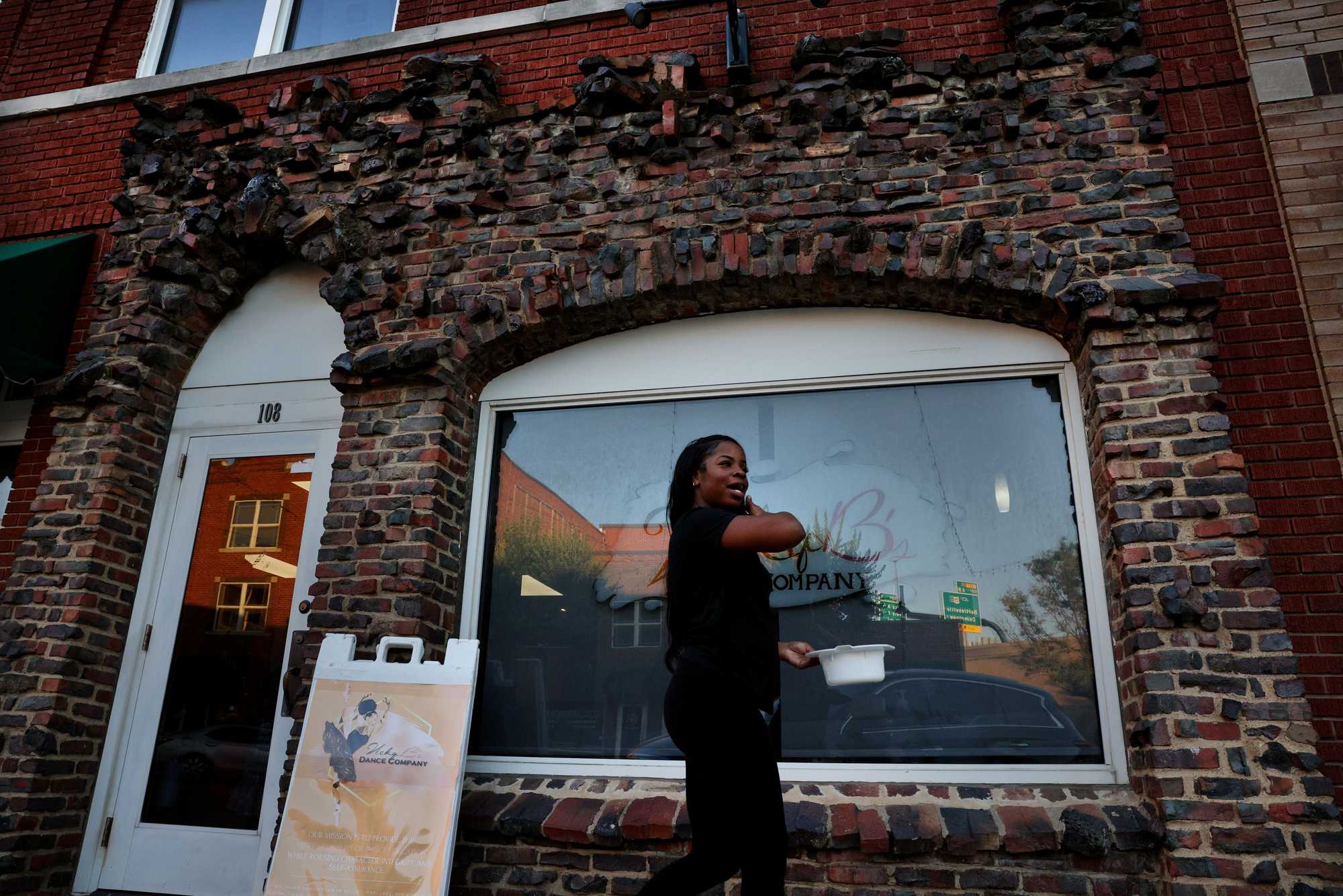 Victoria Brunson, outside her studio VickyB’s Dance Co. in Tulsa's Greenwood District. The bricks on the building were salvaged after the destruction in 1921. 