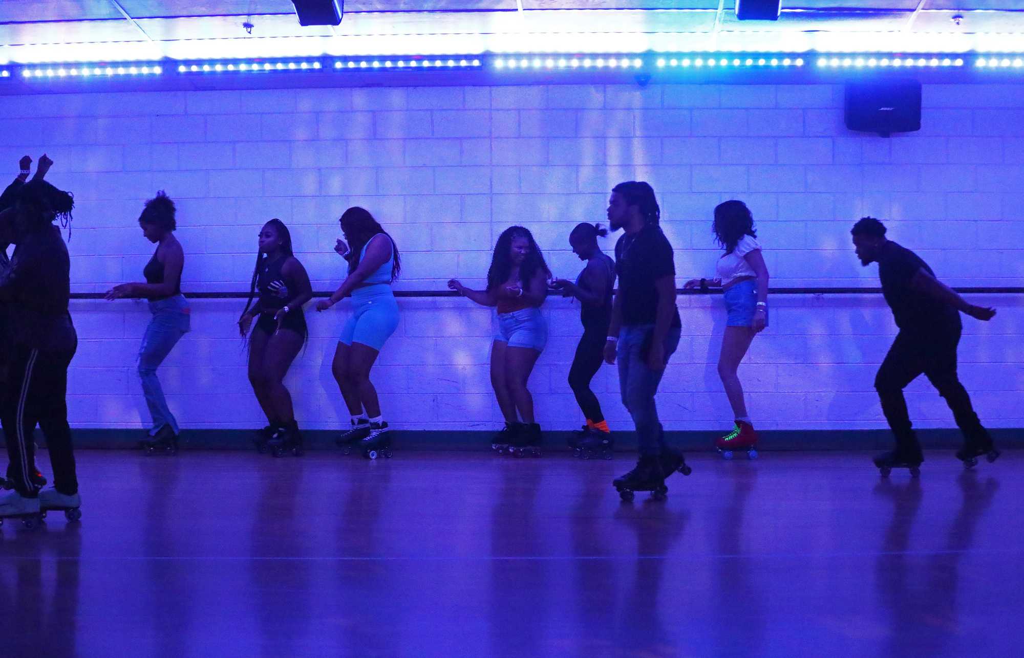 Some skaters ran through choreographed moves along the wall during a 21-plus skate night at The Place Cincy.


