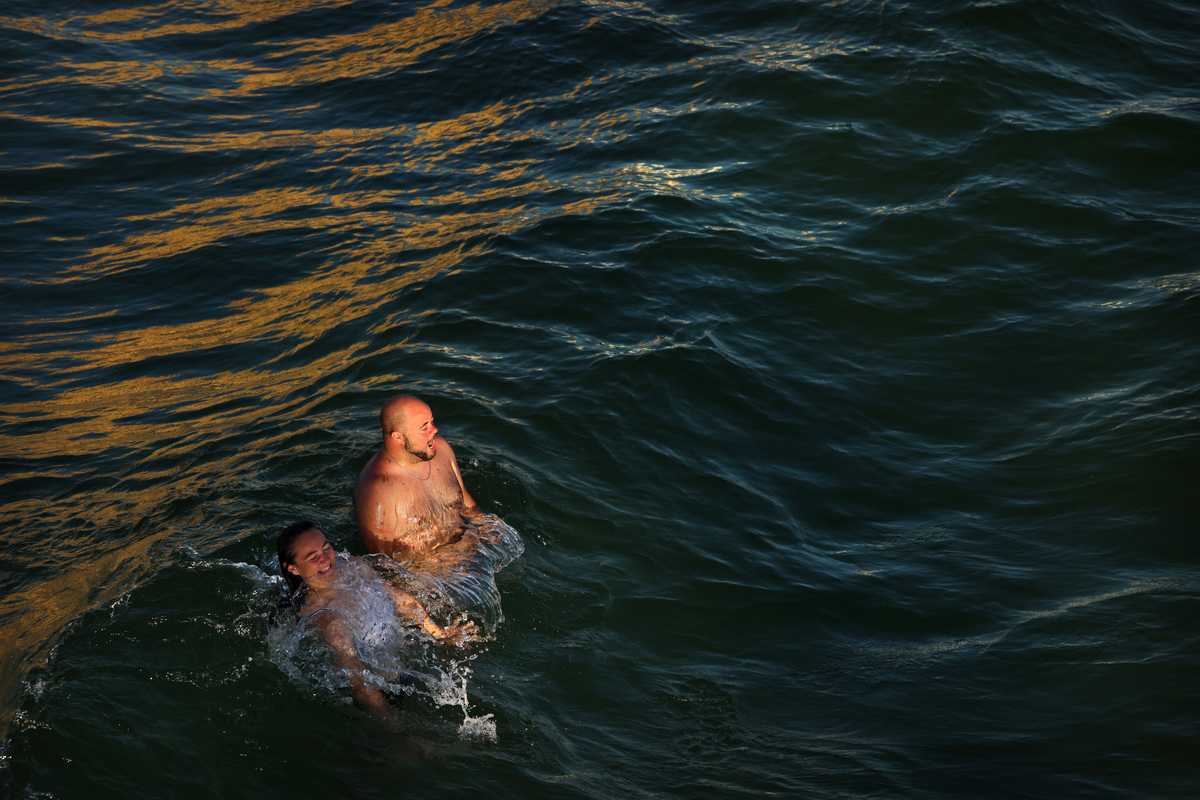 A couple enjoyed swimming in the Gulf of Mexico in Panama City Beach, Fla., on Sept, 17.