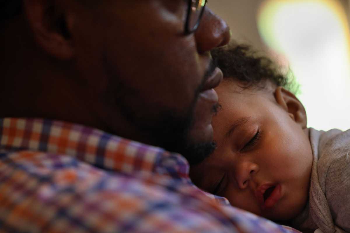 Dion Gulliver, a senior pastor at the historic Tabernacle Baptist Church in Selma, Ala., comforted his 5-month-old daughter, Otilya, in the church on Sept. 16.
