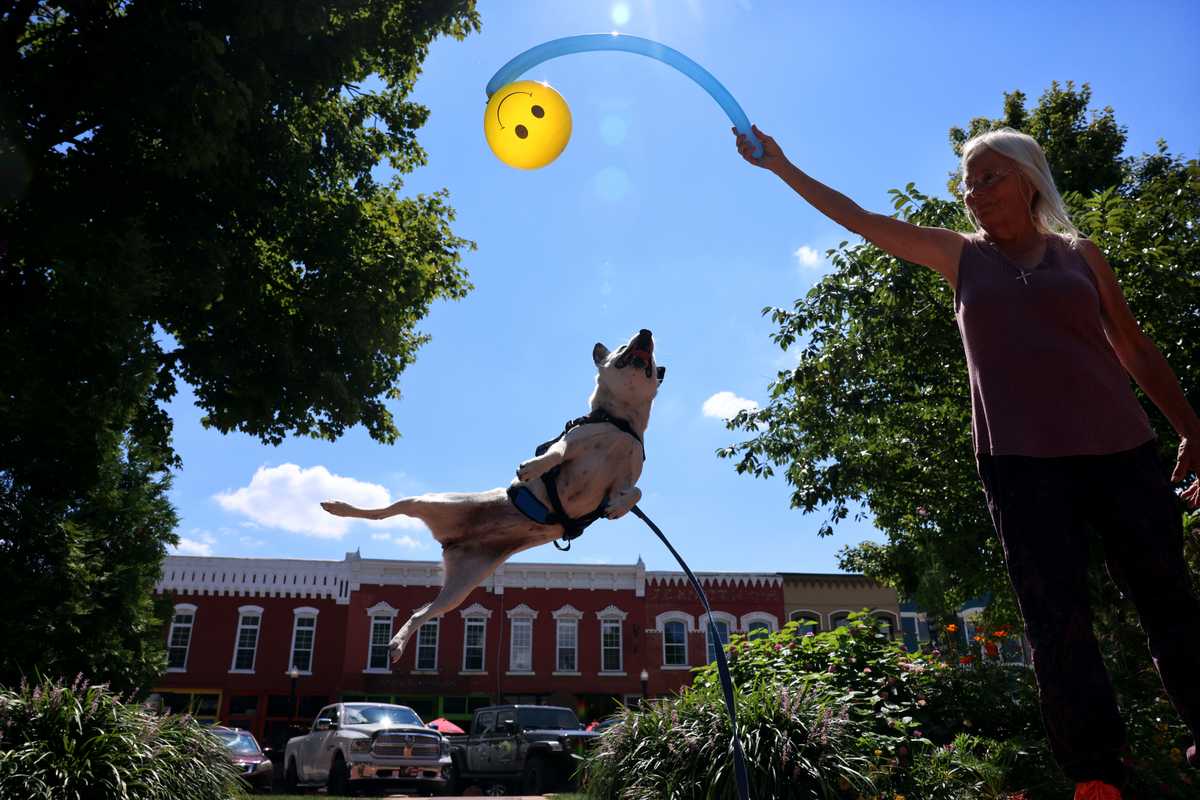 Jenny Coats and her dog, Oreo, show off some of their tricks in Bentonville, Ark.