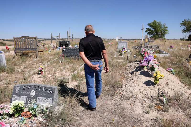 Fred Ecoffey, a legendary Lakota horseman, kept a finger looped in his back pocket as he walked away from his wife’s grave in the Wounded Knee cemetery. She is buried near a mass grave for some 300 Lakota killed in the Wounded Knee Massacre in 1890.
