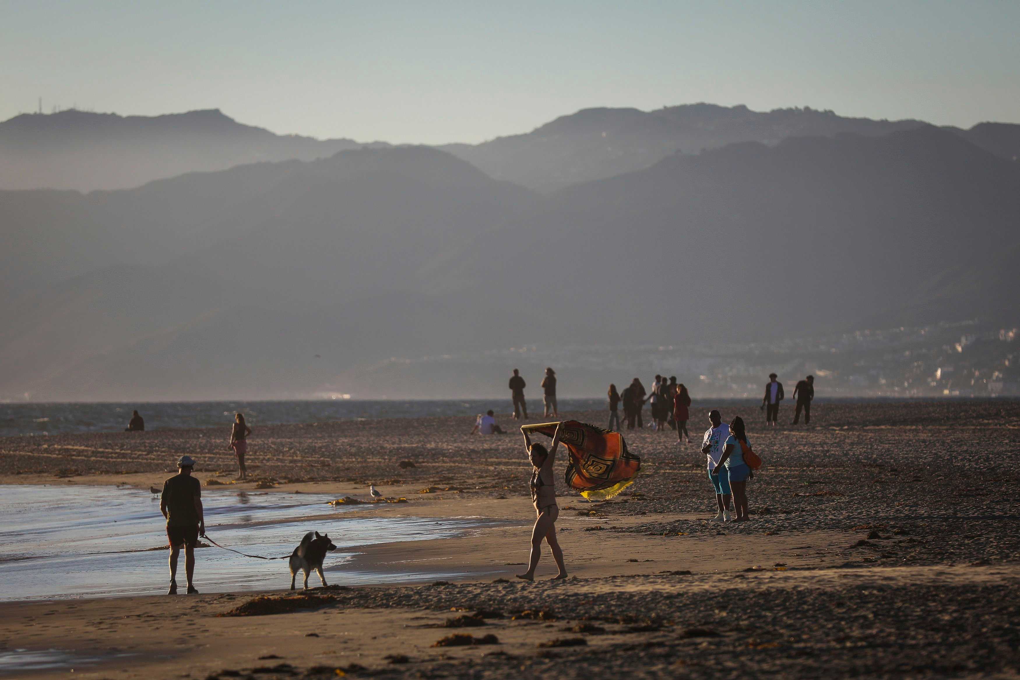 Beachgoers enjoy the last bit of sunshine on Venice Beach in California on Sept. 19.