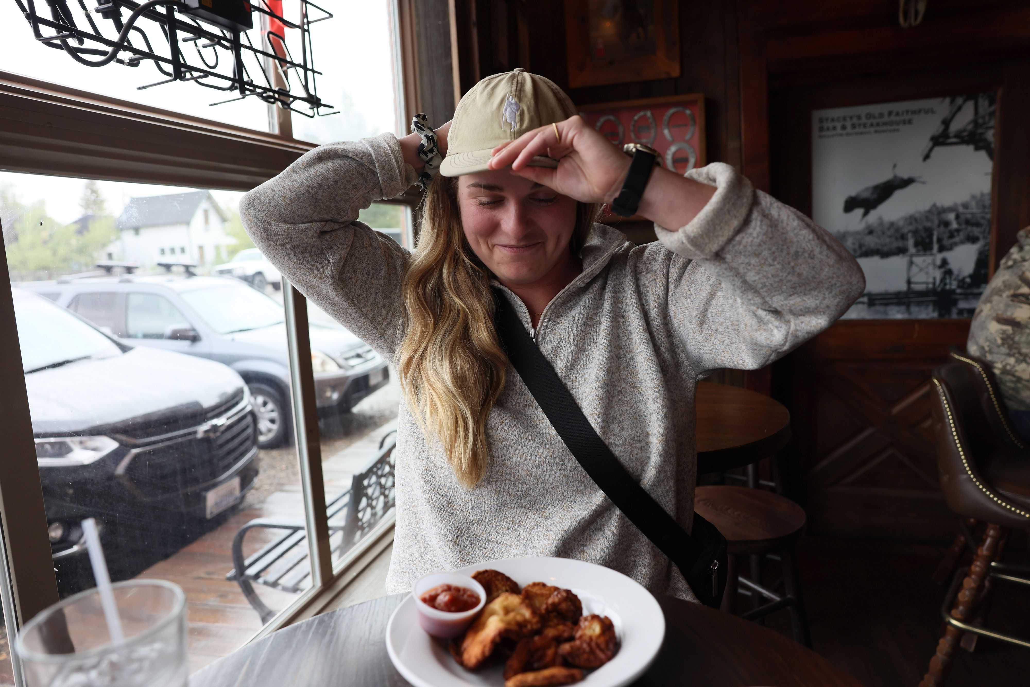 Globe reporter Hanna Krueger prepares to try Rocky Mountain Oysters, a dish made from bull testicles, at Stacey's Old Faithful Bar & Steakhouse in Gallatin Gateway, Mont.