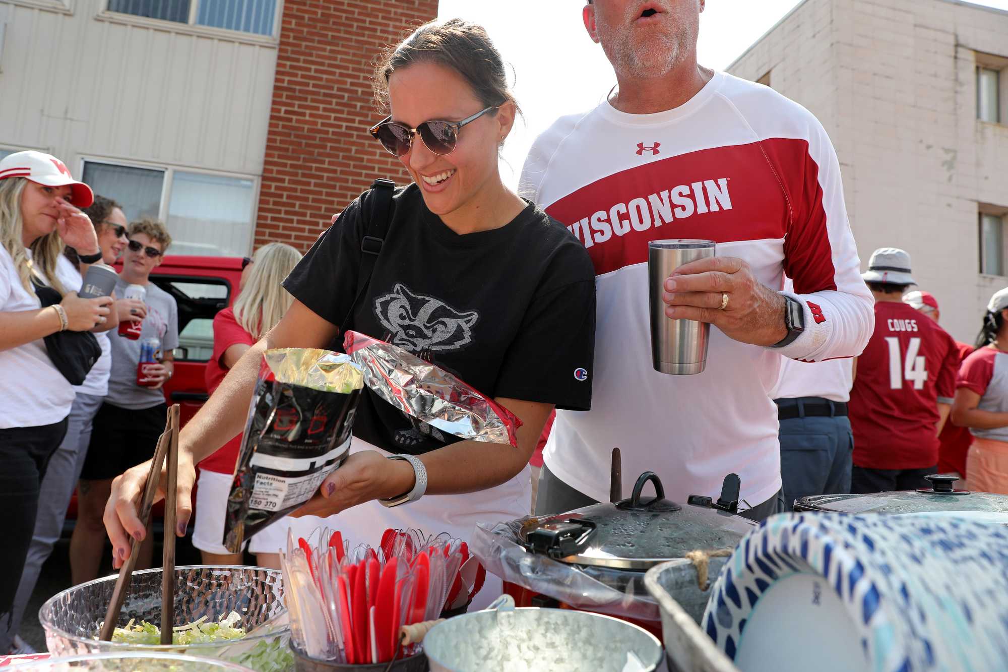 Lauren Schleicher, a new local fan from Middleton, Wis., made herself a “walking taco” at one of the tailgate parties.