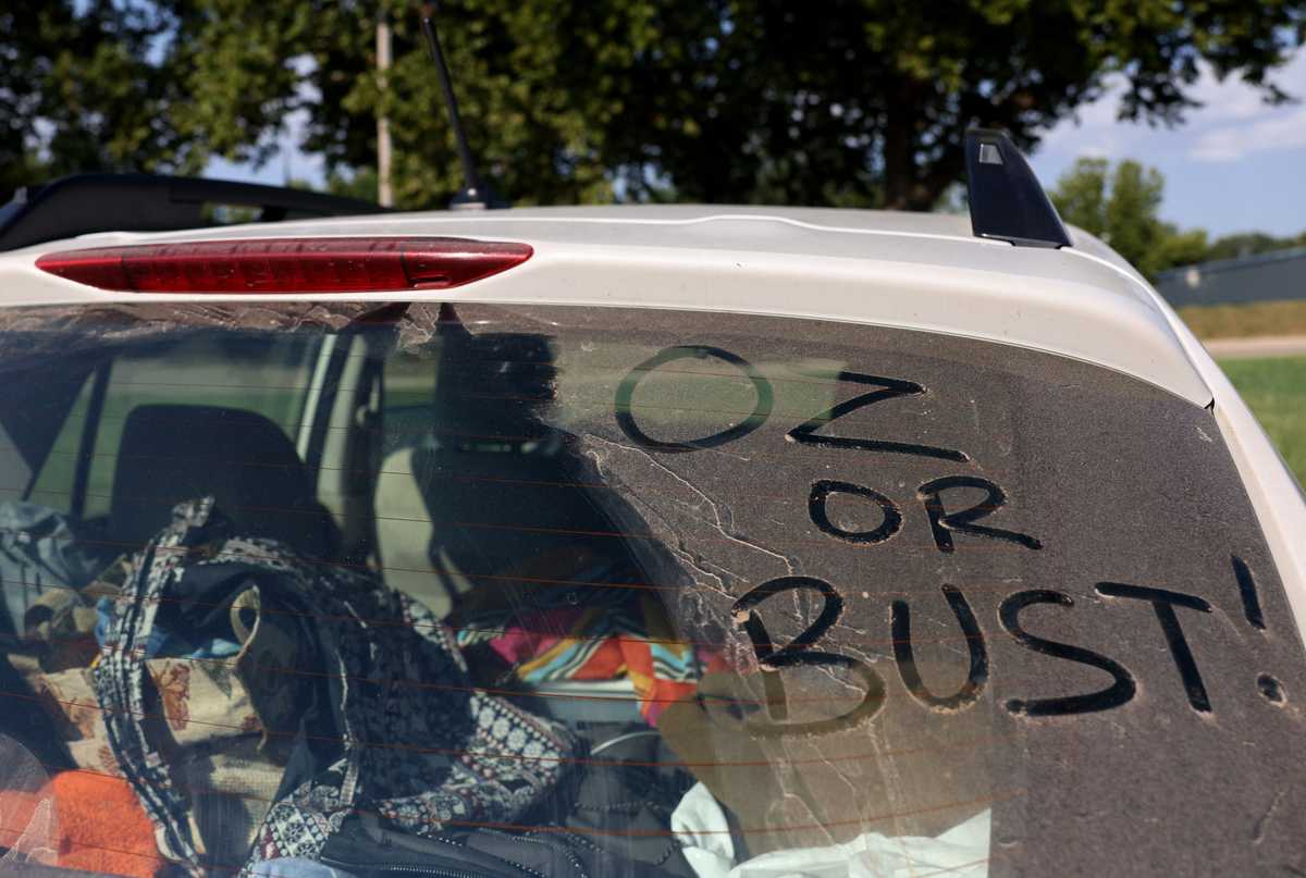 Laura Fredrickson scratched the words, “OZ or Bust!” into the dust on her back windshield.  