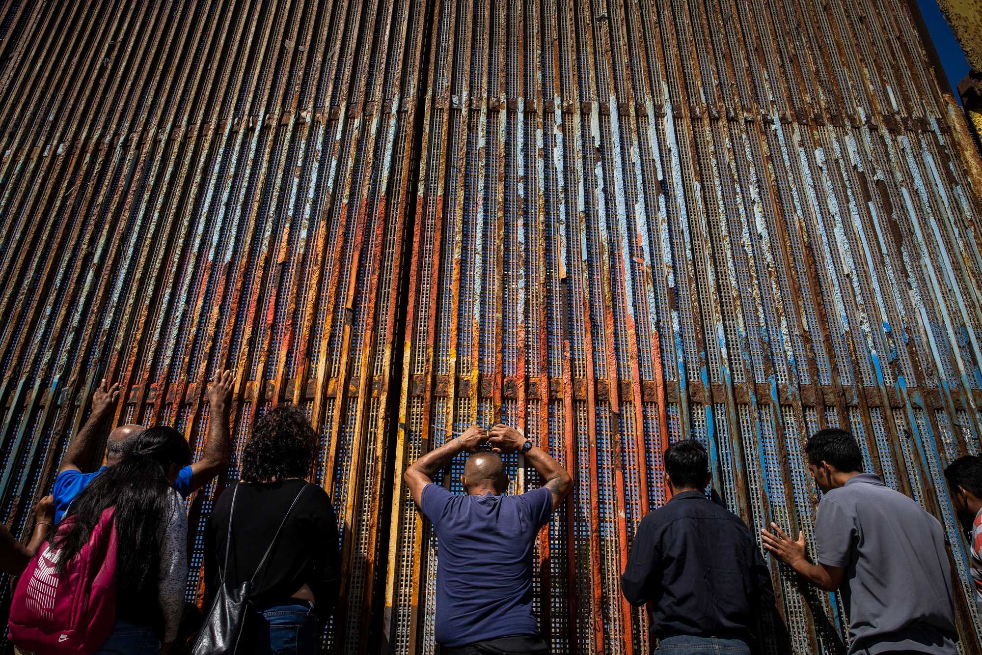 Congregants prayed along the border wall.