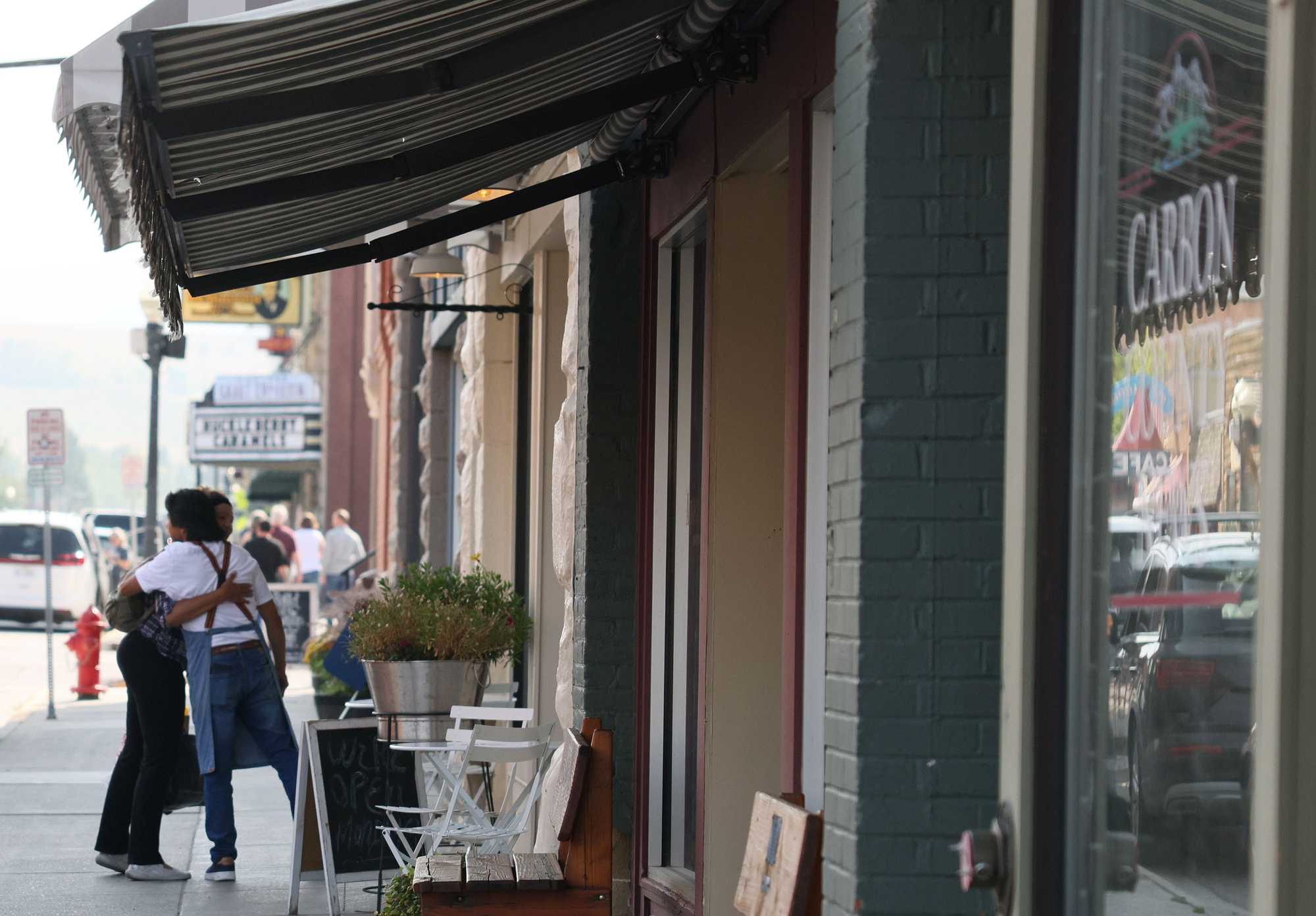 People embraced along Broadway Avenue in Red Lodge, Mont.