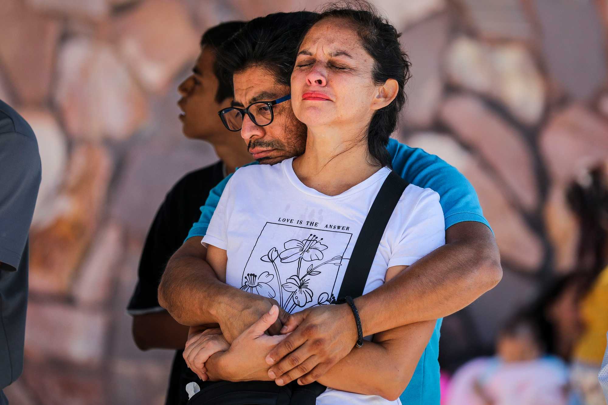 A couple embraced while attending The Border Church service.