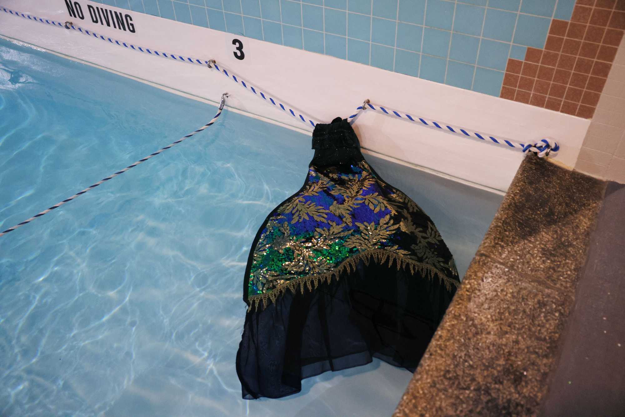 During one of her 15-minute breaks, Mermaid Marvel left her tail in the pool so it would stay warm. The tails weigh upward of 10 pounds when they are wet.