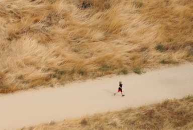 A child sprinted down a path as seen from the top of Camel's Back Park, an 11-acre urban park in Boise, Idaho. 