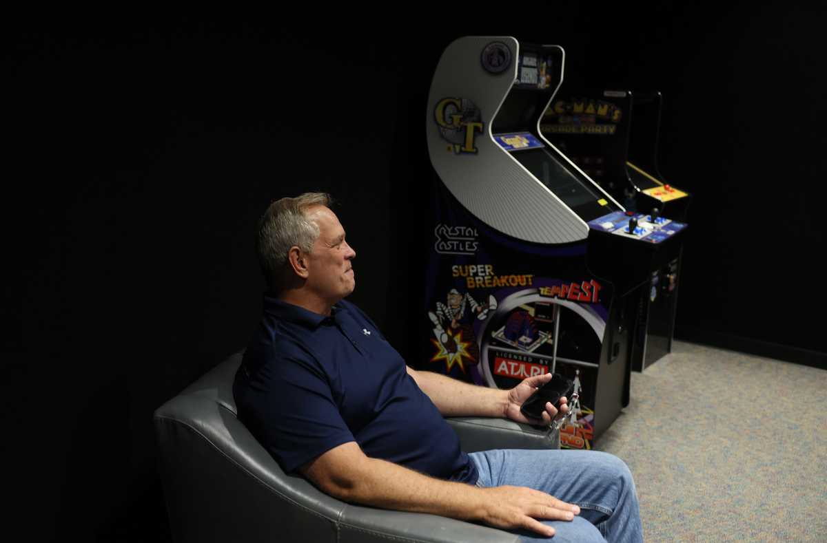 Larry Hall sat in one of the common rooms inside the Survival Condo. It's outfitted video games.