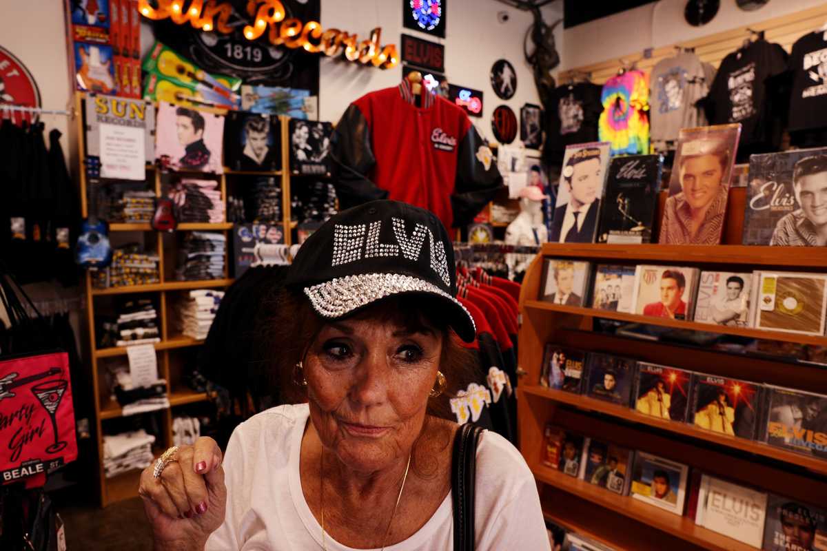 Linda Mullaney of Orland Park, Ill., tried on an Elvis hat while shopping at Boulevard Souvenirs and Gifts in Memphis.