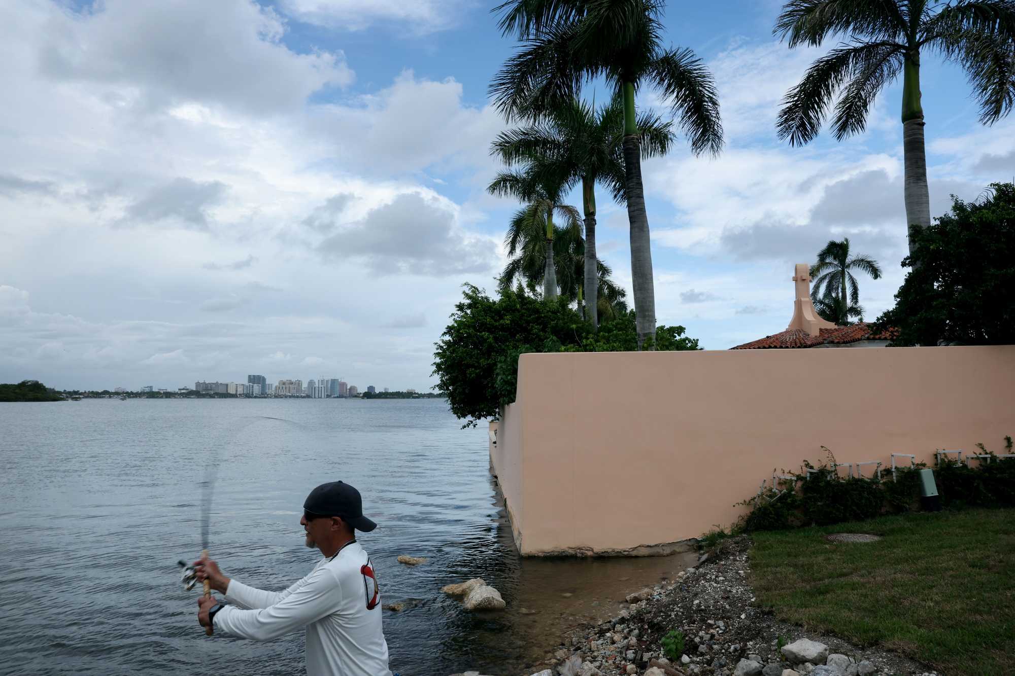 Palm Beach resident Joseph Cafarelli fished off the shore of Lake Worth Lagoon outside the Mar-a-Lago Club. 