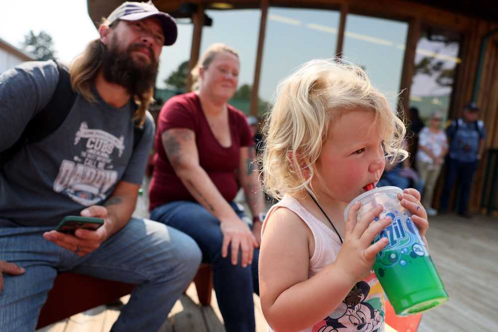 Abigail Pope, 2, cooled off with a slushy as she and her family took in a hoop dance performance at Crazy Horse Monument in South Dakota.