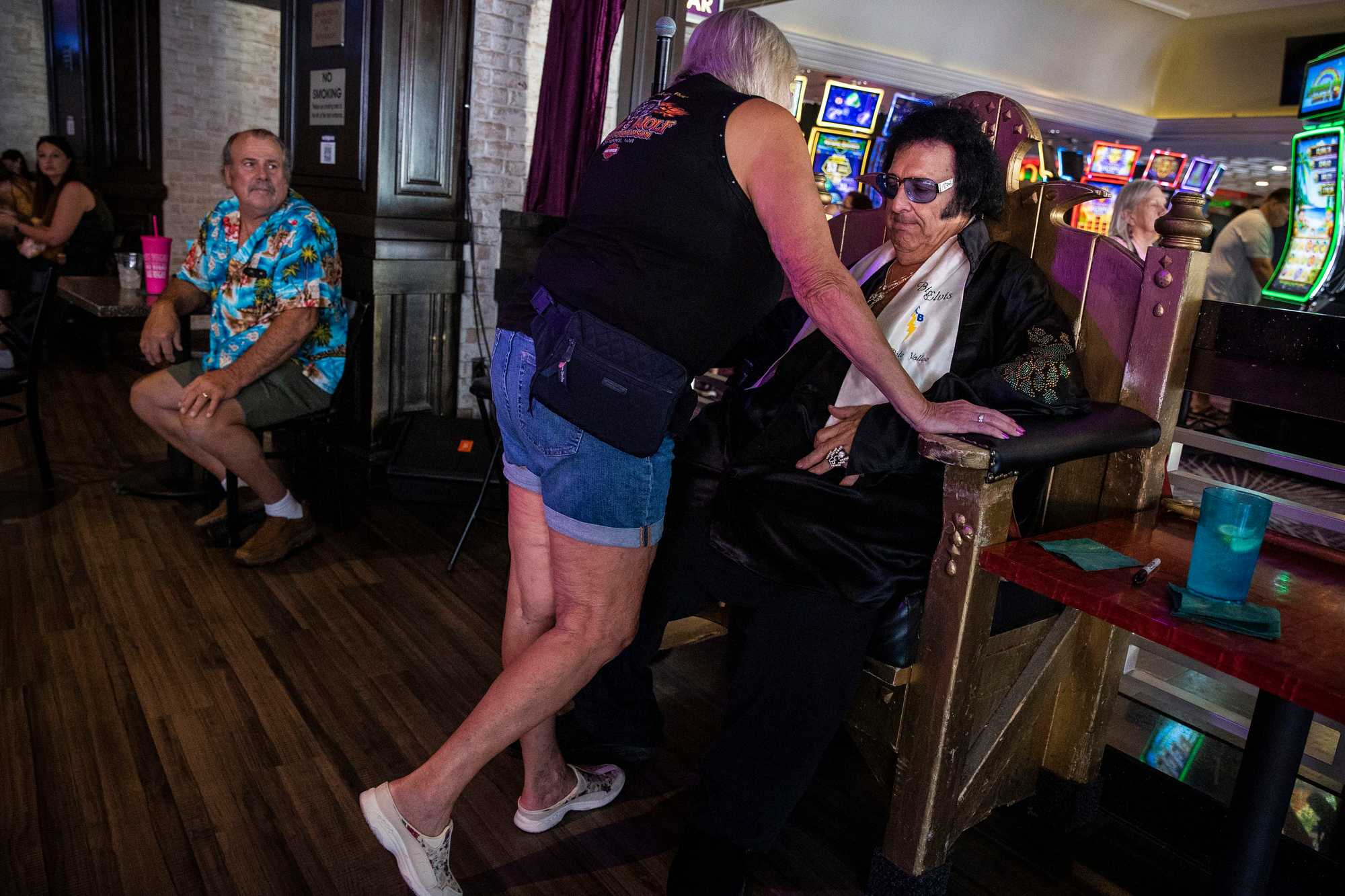 Nancy Weyer leaned over Big Elvis, a.k.a. Pete Vallee, while her new husband looked on, at Harrah's in September.

