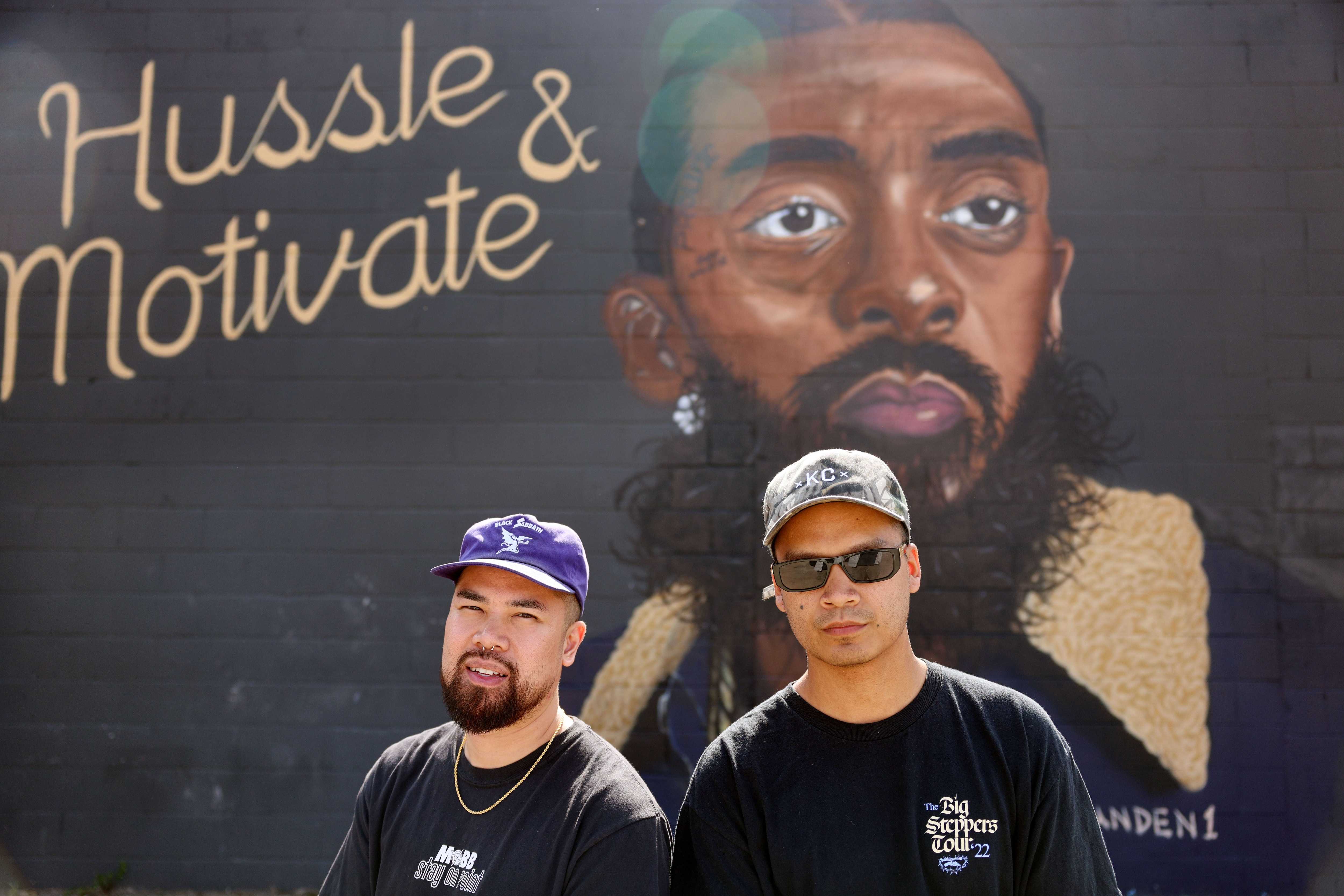 Vu Nguyen (left) and Jesse Phouangphet outside their shop in Kansas City, Mo.