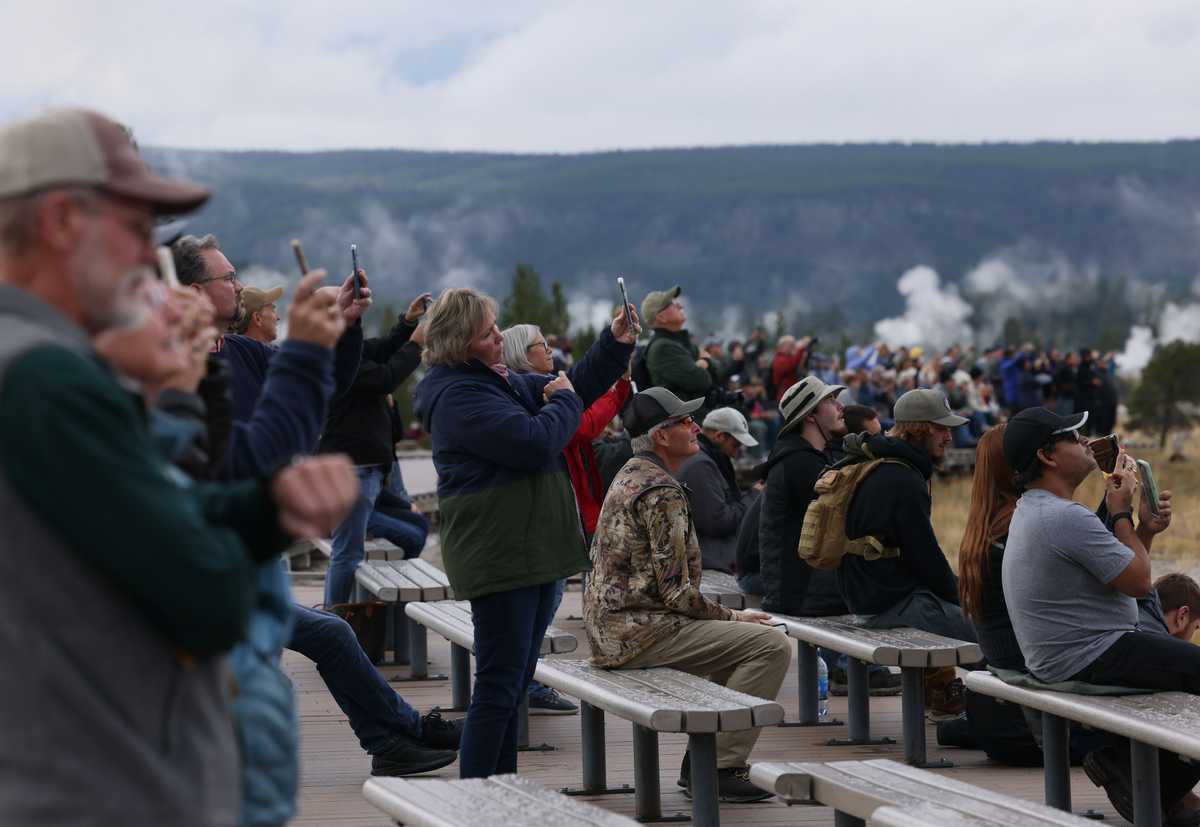 Visitors recorded an Old Faithful eruption on their cellphones. 