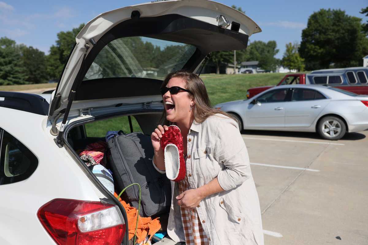  Laura Fredrickson pulled a pair of ruby slippers from the trunk of her car as she told a Globe reporter how excited she was to head to the OZ Museum.  