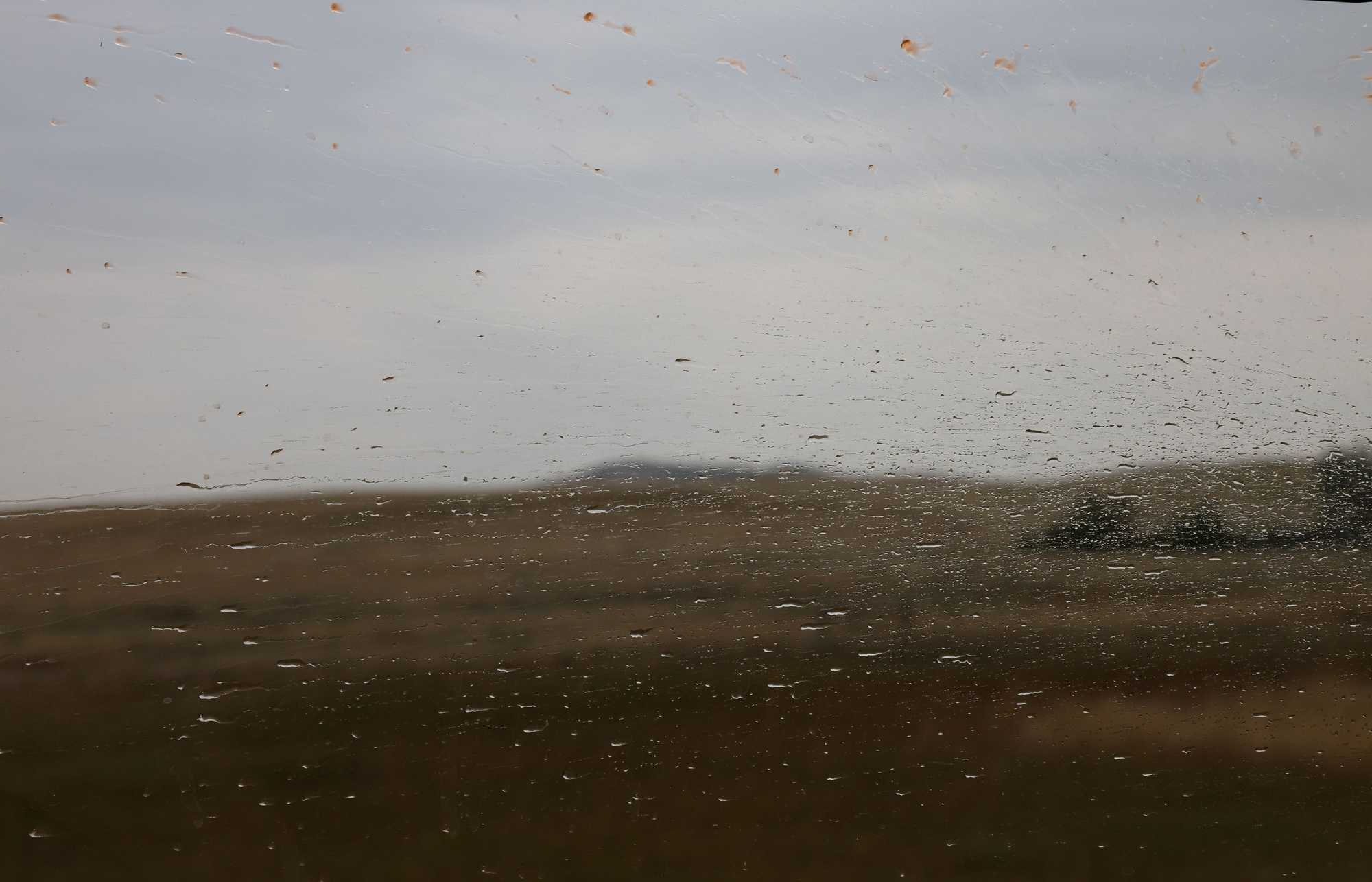 Rain streaked across the window obscuring a view of the Crow Nation reservation in Montana where Bonnie Three Irons was found dead in 2017.