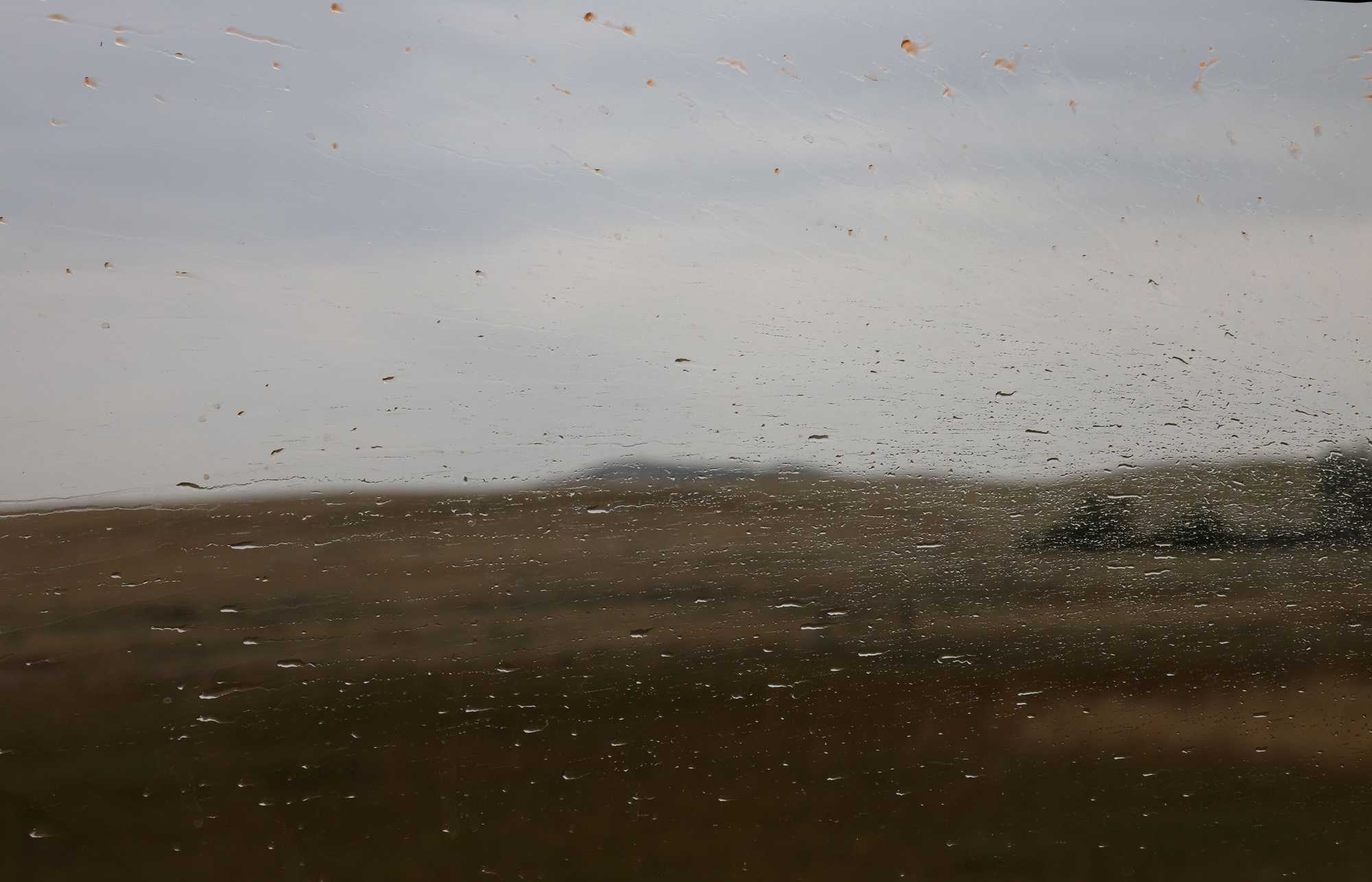 Rain streaked across the window obscuring a view of the Crow Nation reservation in Montana where Bonnie Three Irons was found dead in 2017. 