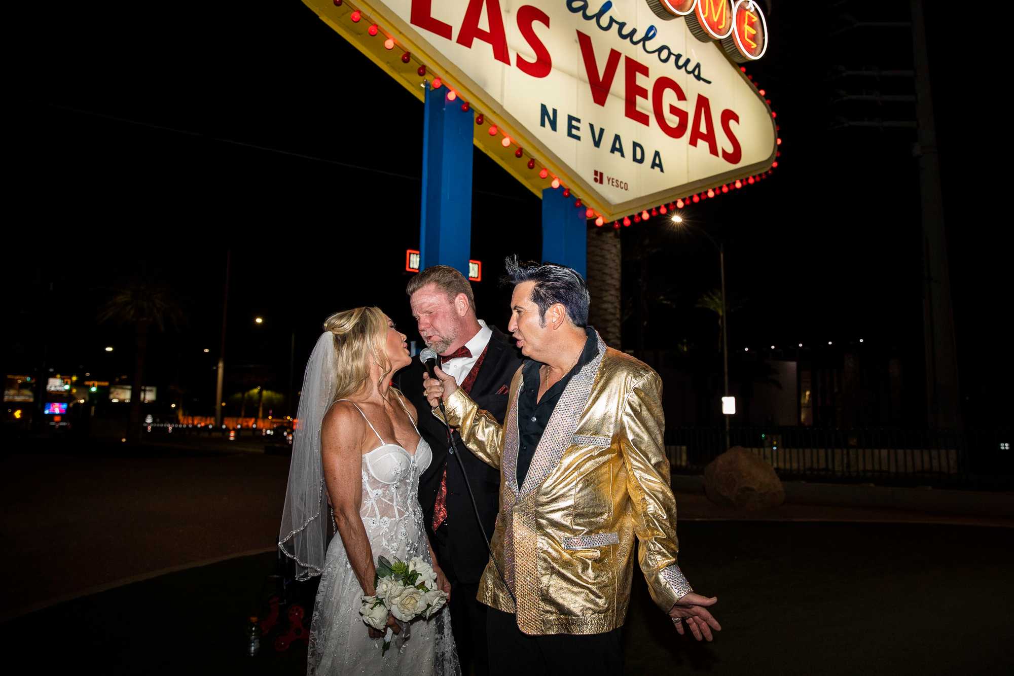 Jesse Grice, an Elvis impersonator for more than 30 years, officiated a ceremony for Susan and Dean Norsworthy underneath the famous “Welcome to Fabulous Las Vegas sign” that marks the beginning of the Strip.
