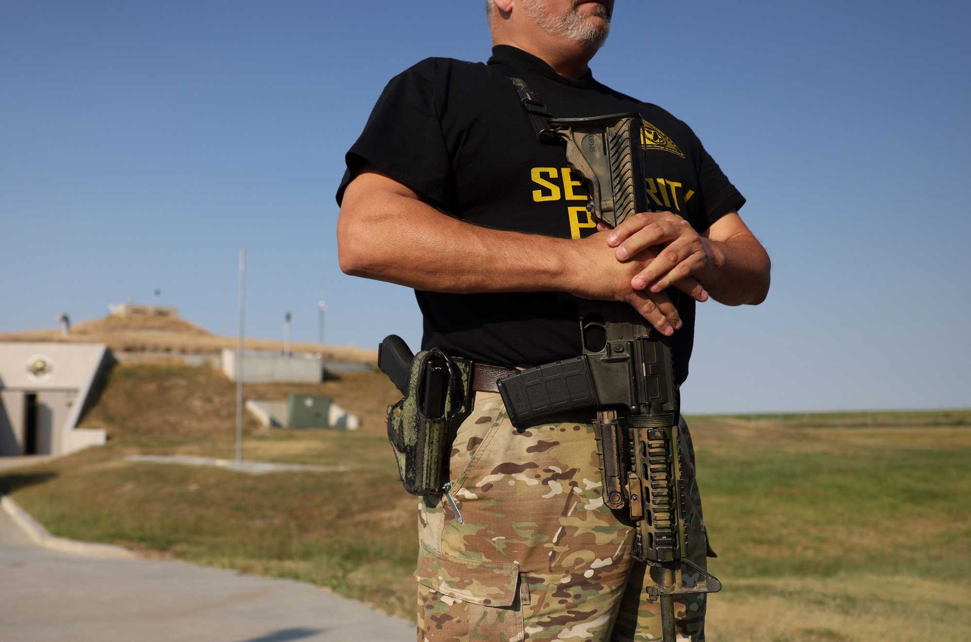 An armed guard on duty outside the Survival Condo in Kansas.