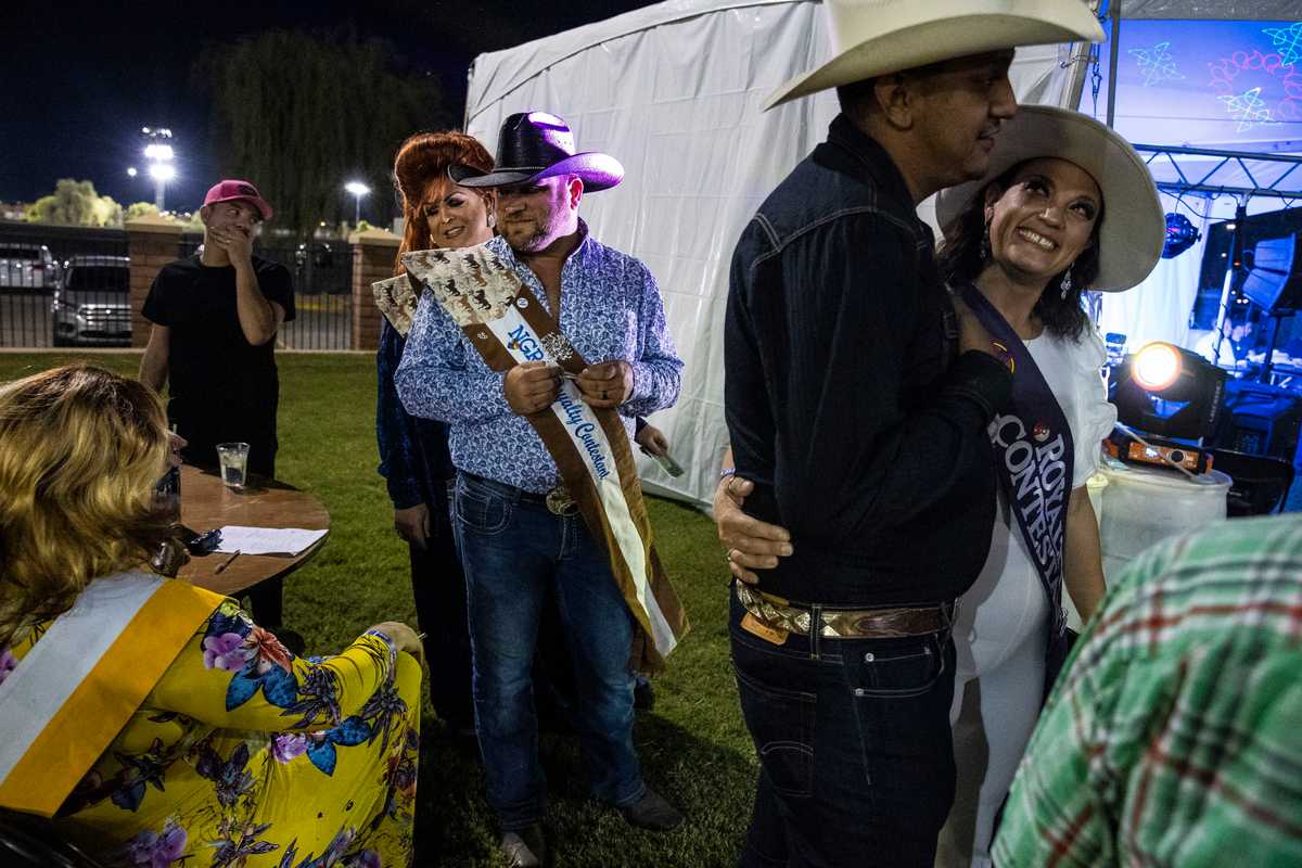 Cowboys and drag queens prepare to perform at the rodeo in September.