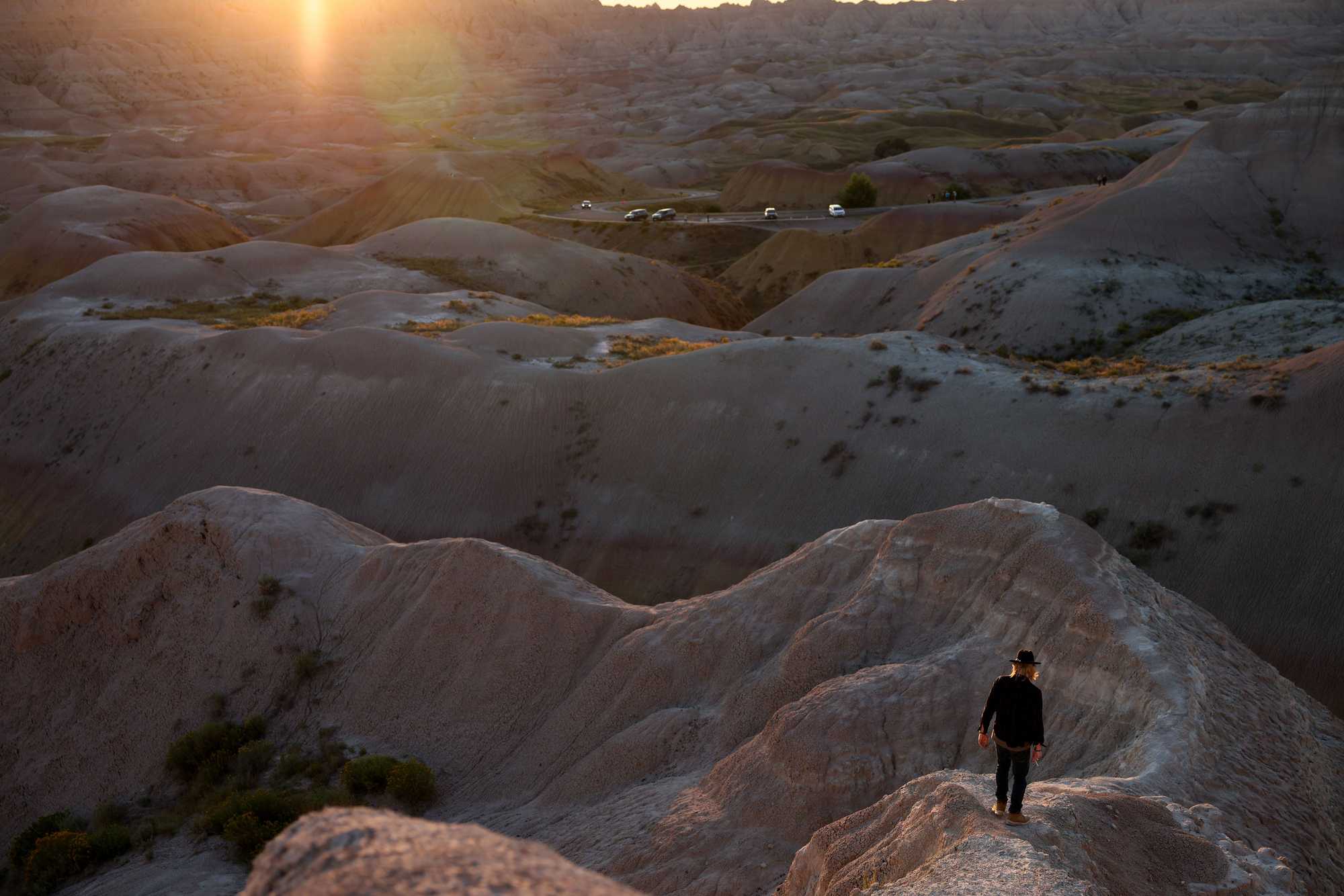 A visitor hiked down into Badlands National Park to take in the sunset. 