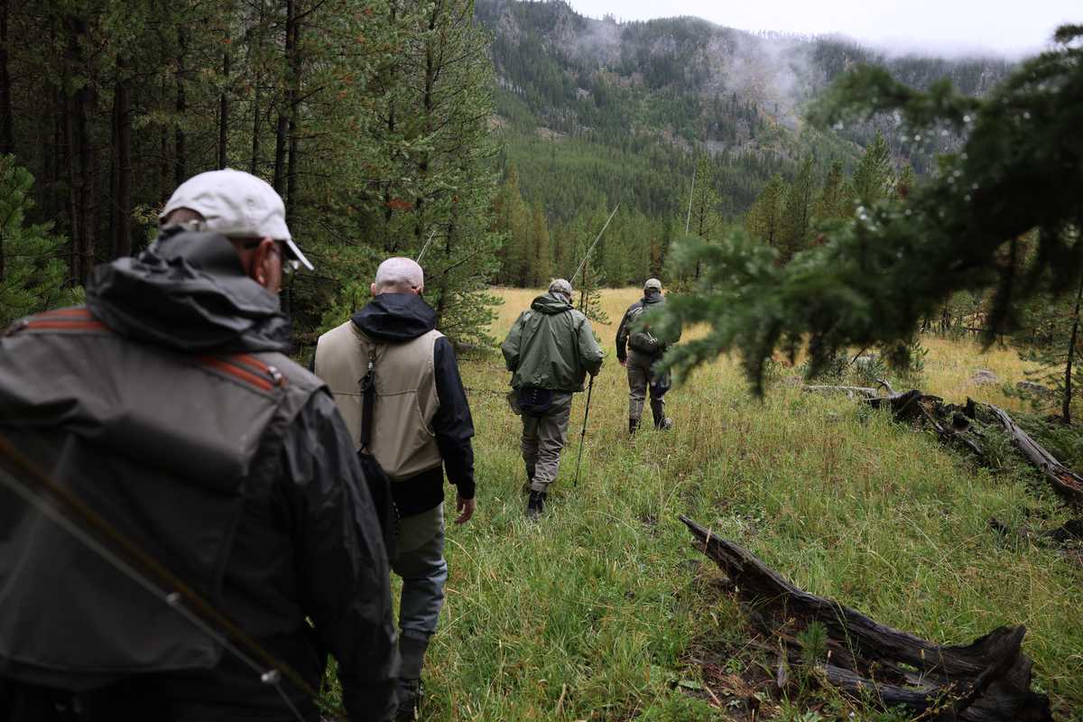 From left: Cliff Myers and his son, Jeff, both of California, headed out with Avrum Clapper and his son, Lawrence, both of Portland, Ore., as they headed the Madison River to fly fish.