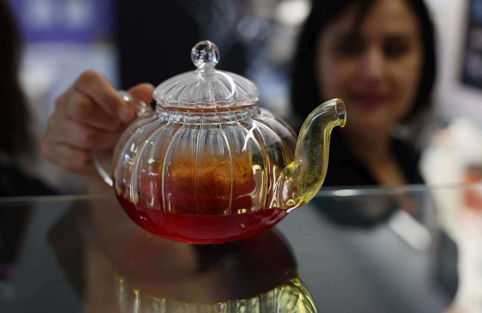 Khatera Shams held a teapot full of saffron that is used for saffron tea.