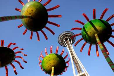 Seattle’s famed Space Needle is framed through Dan Corson’s sculpture called Sonic Boom. 