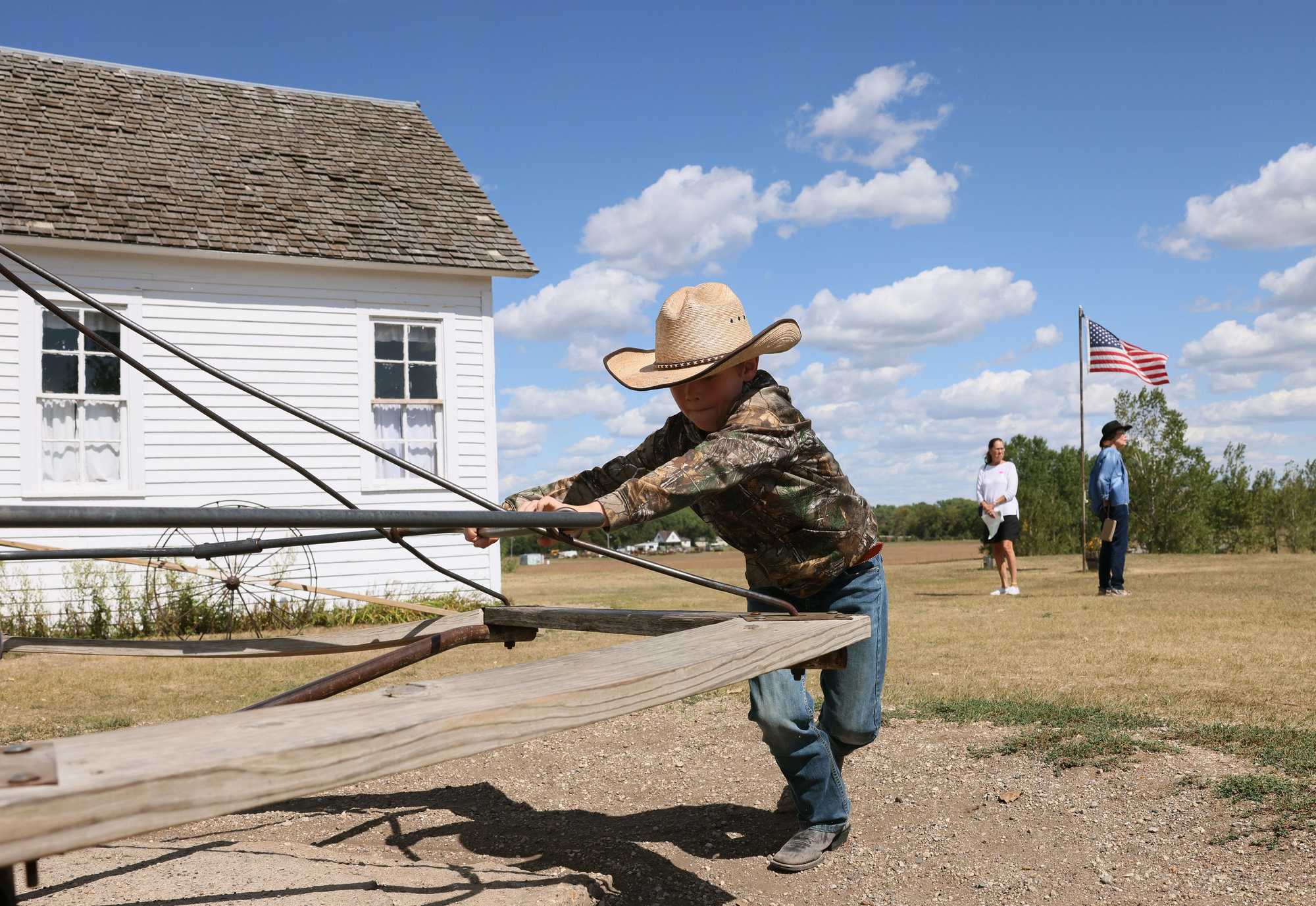 Eight-year-old Fisher from Lehigh, Iowa, played on the homestead's merry-go-round.