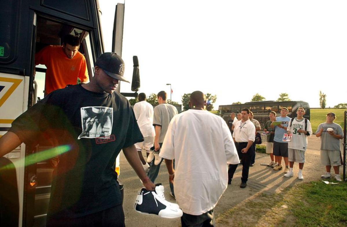 Lebron James exits the team bus to a crowd of fans.