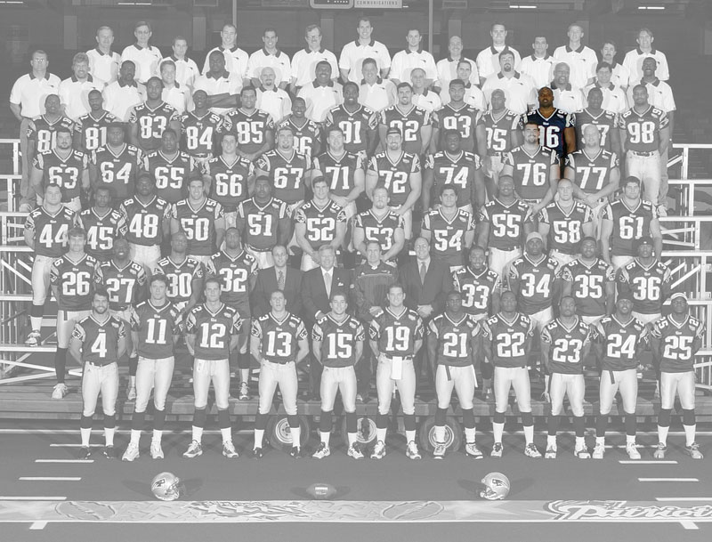 A team photo of the Super Bowl 36 champion New England Patriots, with the color removed, except for Brandon Mitchell