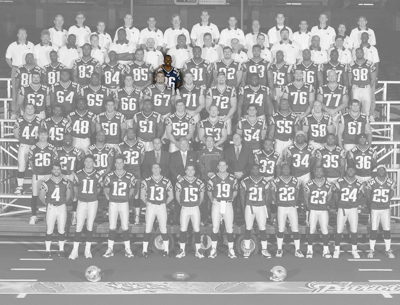 A team photo of the Super Bowl 36 champion New England Patriots, with the color removed, except for David Patten