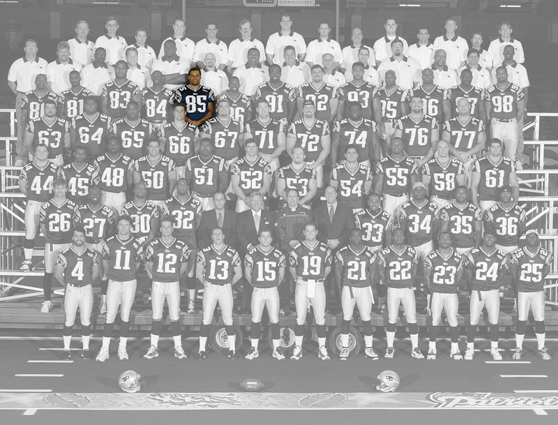 A team photo of the Super Bowl 36 champion New England Patriots, with the color removed, except for Jermaine Wiggins