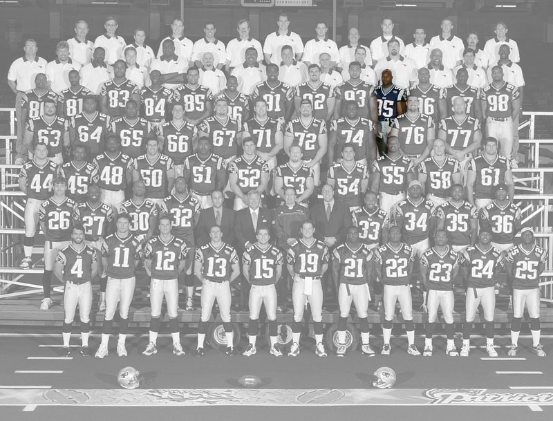 A team photo of the Super Bowl 36 champion New England Patriots, with the color removed, except for Roman Phifer