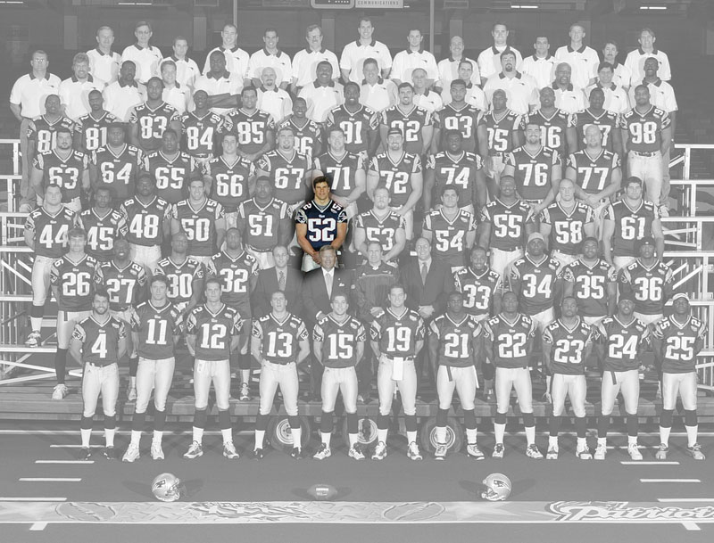 A team photo of the Super Bowl 36 champion New England Patriots, with the color removed, except for Ted Johnson